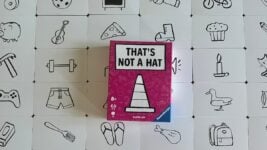 That's Not a Hat board game review showing the game's cards, memory and bluffing mechanics, player count, components, rules, and gameplay.